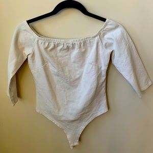 Like a bird off the shoulder white body suit